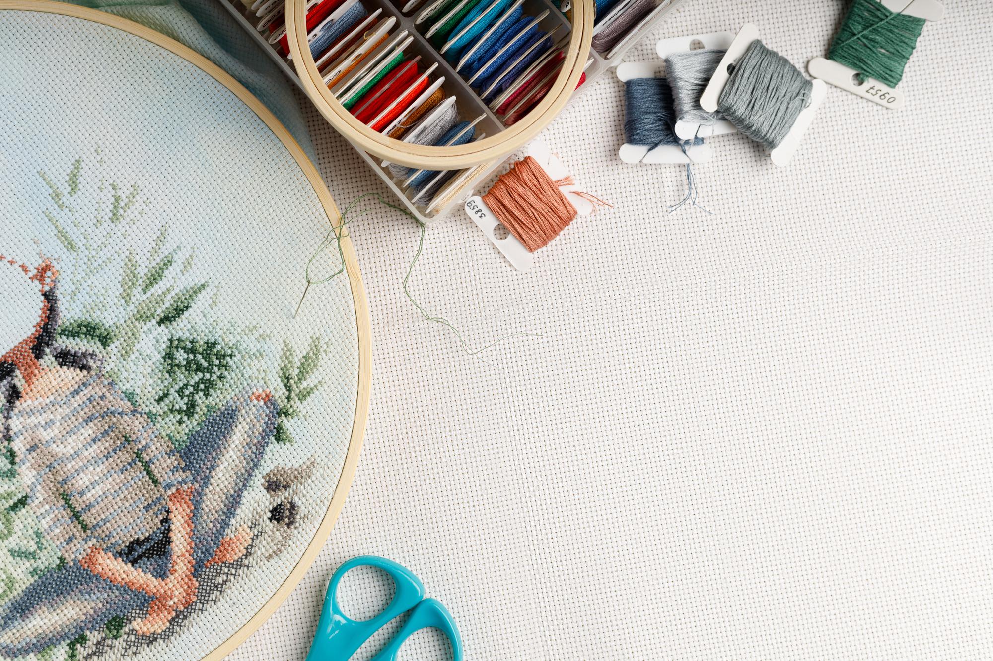 Work desk with threads and embroidery machine