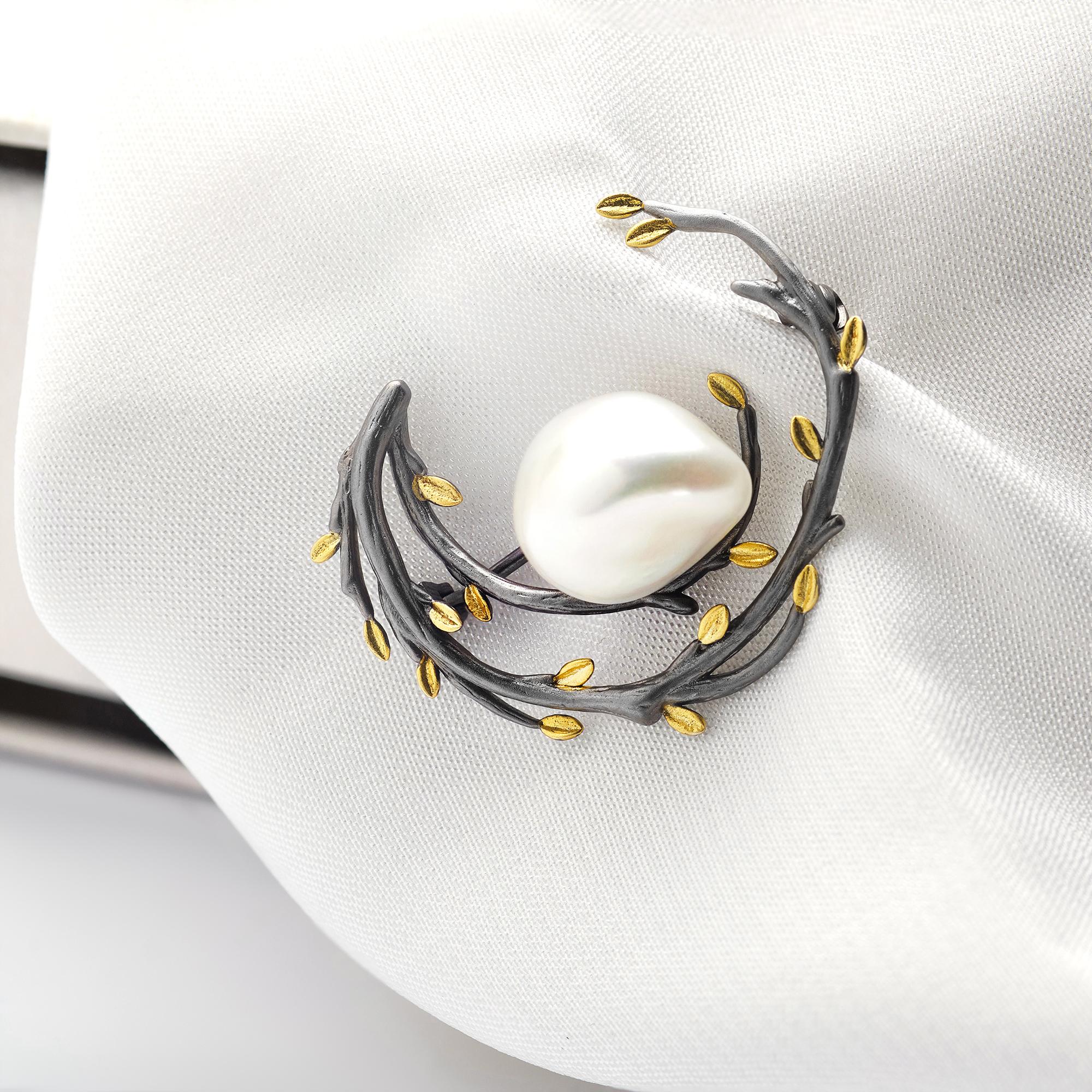 Detailed close-up of embroidered badge with metallic thread